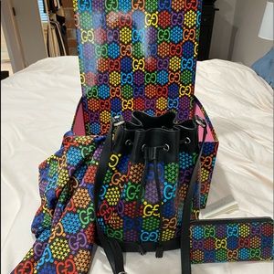 Gucci Psychedelic bucket bag and matching wallet.